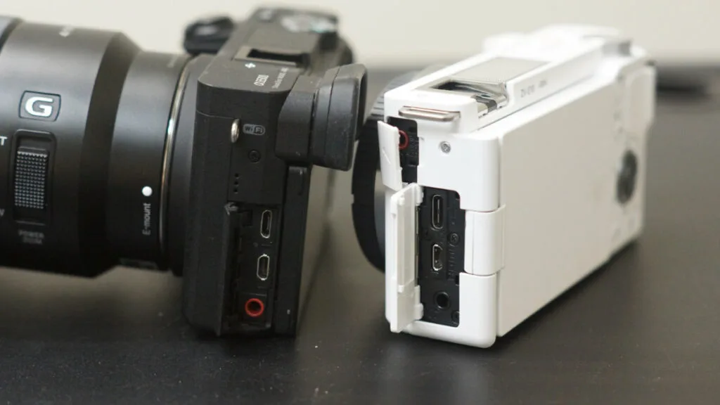 Side view of Sony a6500 and ZV-E10 cameras, comparing their port layouts and connectivity options.